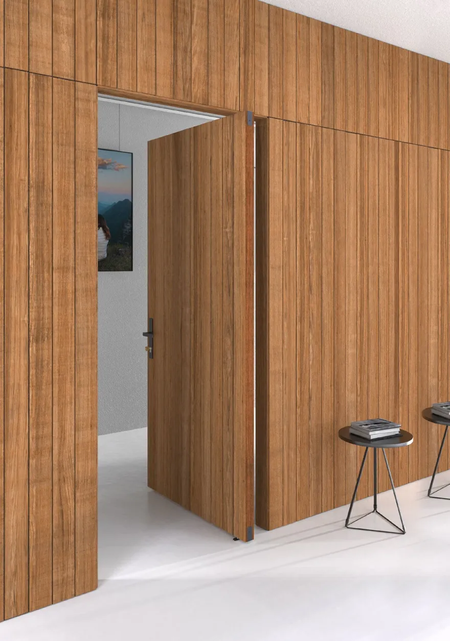 Pivote superior con eje articulado para puertas batientes